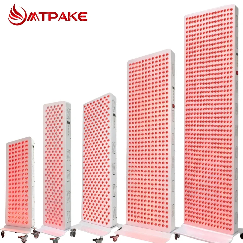 Five different sized tall, rectangular red light therapy panels with glowing red LEDs, on wheeled stands.