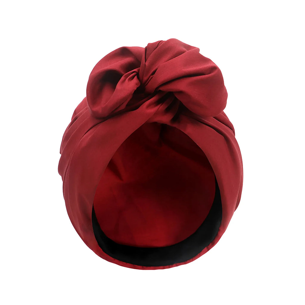 Deep red French vintage-style turban hat featuring a decorative knotted bow detail on the front.