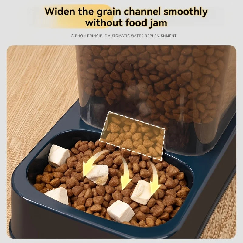 Dark blue automatic pet food dispenser with a clear storage hopper, showing kibble flowing into the feeding bowl.