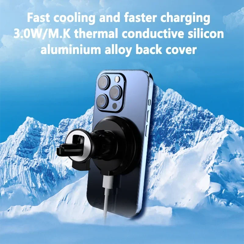 A black circular magnetic phone cooling mount attached to a smartphone against a snowy mountain background.