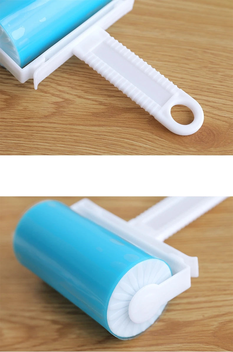 Reusable blue silicone lint roller with a white plastic handle on a wooden surface.
