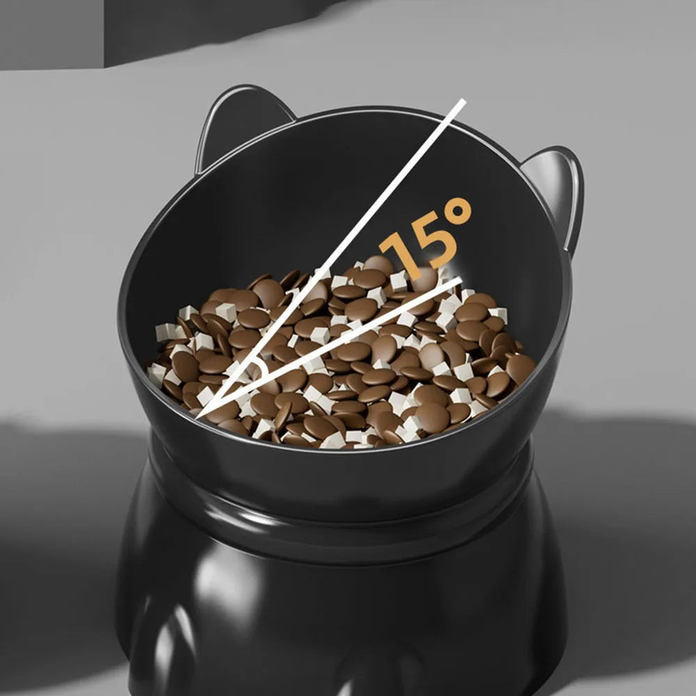 Black cat-shaped elevated pet bowl with a 15-degree tilted dish for ergonomic feeding, filled with dry pet food.