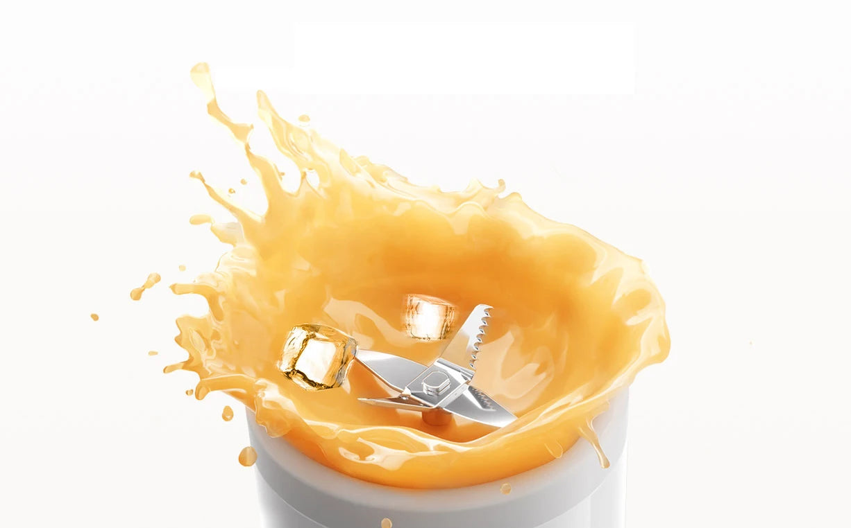 Stainless steel blender blades surrounded by a dynamic orange juice splash and ice cubes against a white background.