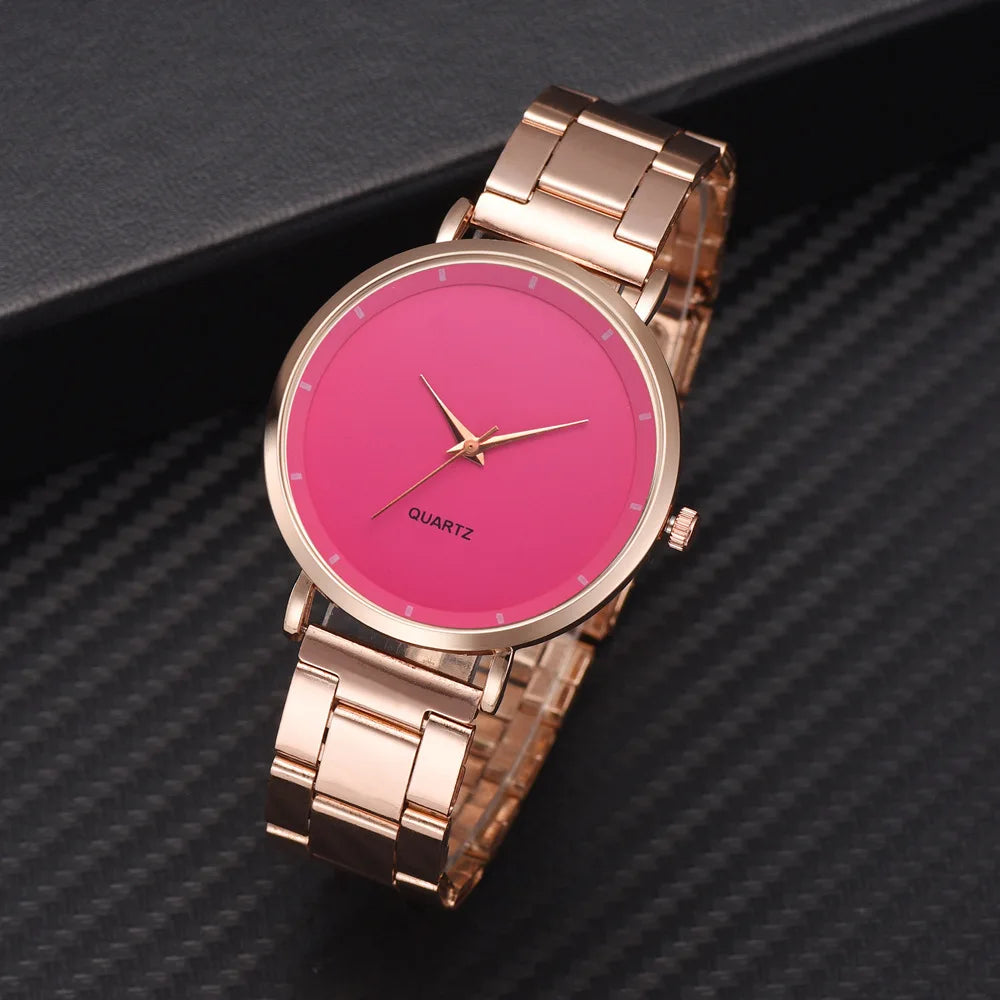 Ladies' rose gold stainless steel watch with a vibrant pink dial and minimalist quartz movement.