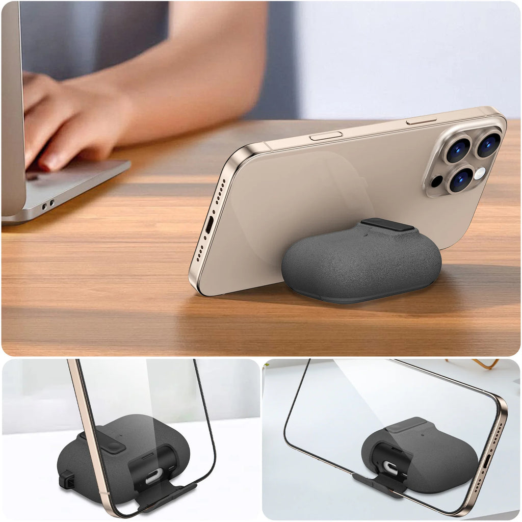 Grey silicone AirPods Pro case with integrated phone stand, supporting landscape viewing on a wooden desk.