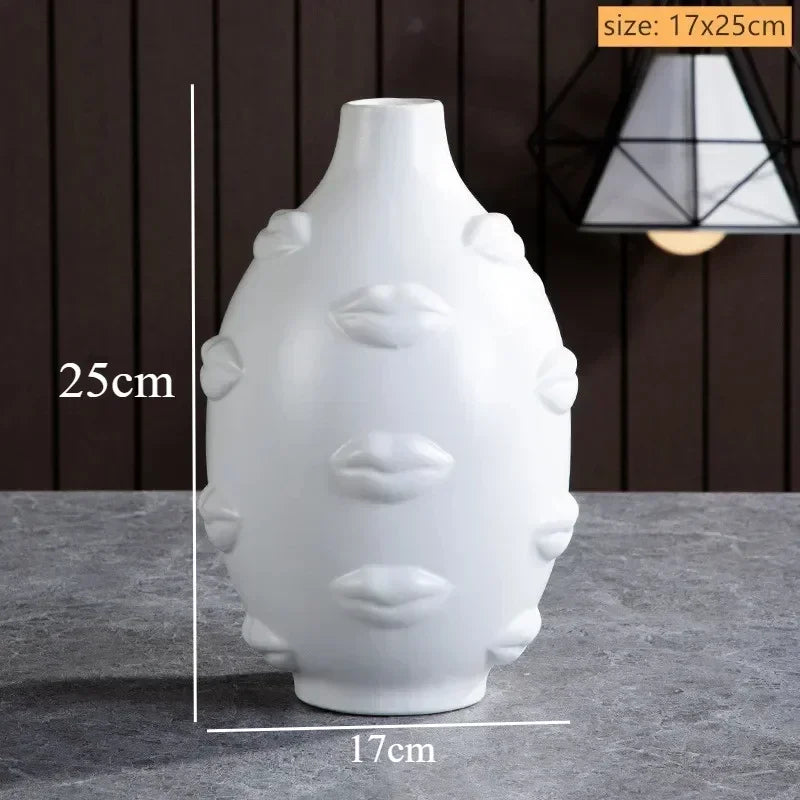 White ceramic decorative vase, 25cm tall, featuring a unique, textured 3D raised lip pattern.