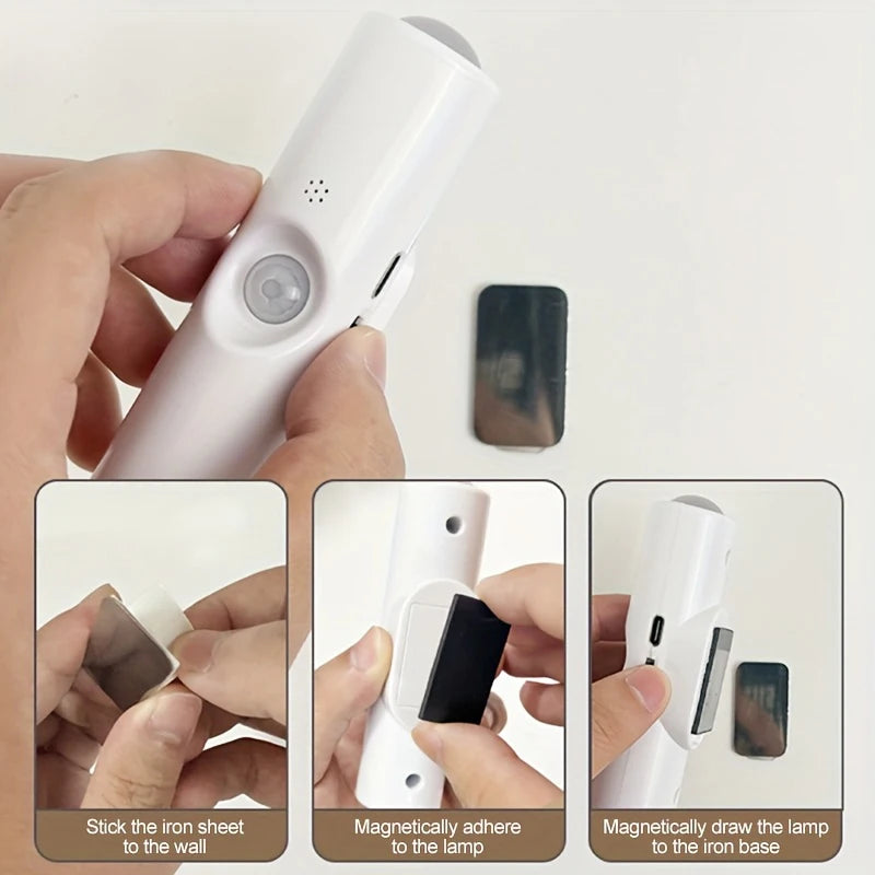 White rechargeable LED motion sensor light with magnetic wall mounting hardware for easy installation.