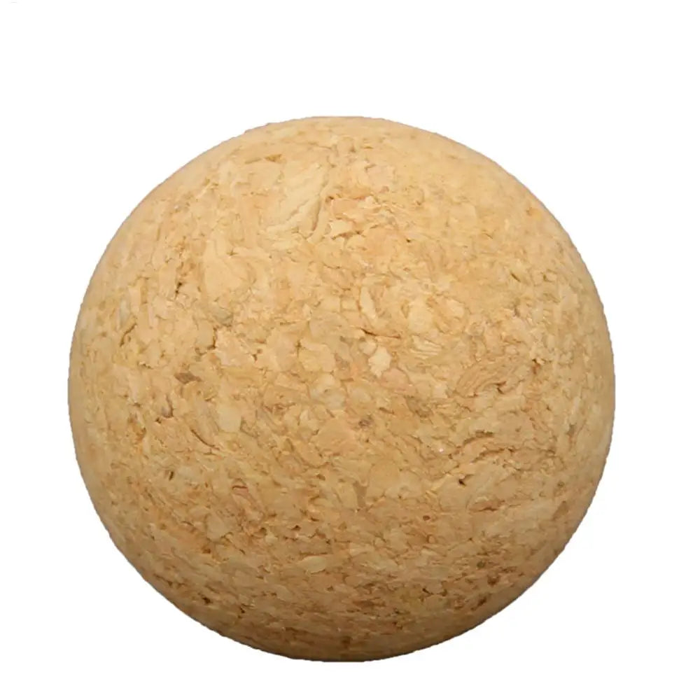 Natural tan cork ball with a textured, granulated surface, isolated on a white background.