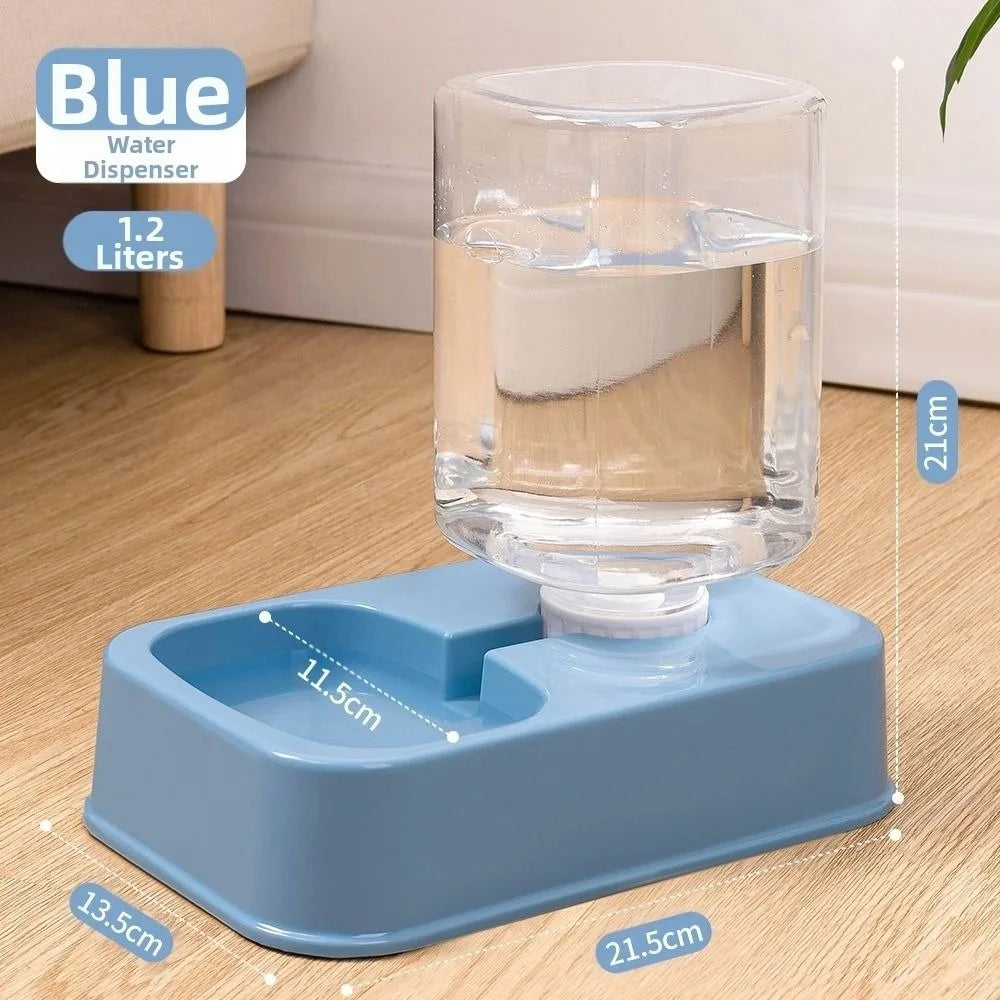 Blue 1.2L pet water dispenser with a clear gravity tank on a rectangular base, set on a wooden floor.