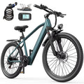 Dark teal adult electric mountain bike with 26-inch knobby tires, front headlight, display screen, and accessories.