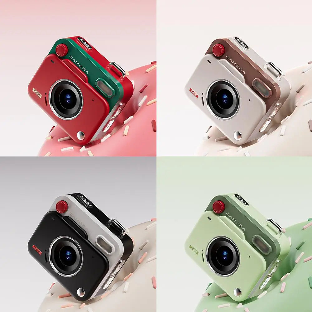 Four small, plastic digital cameras in red, beige, black, and green, each with a red button and 1080p lens.