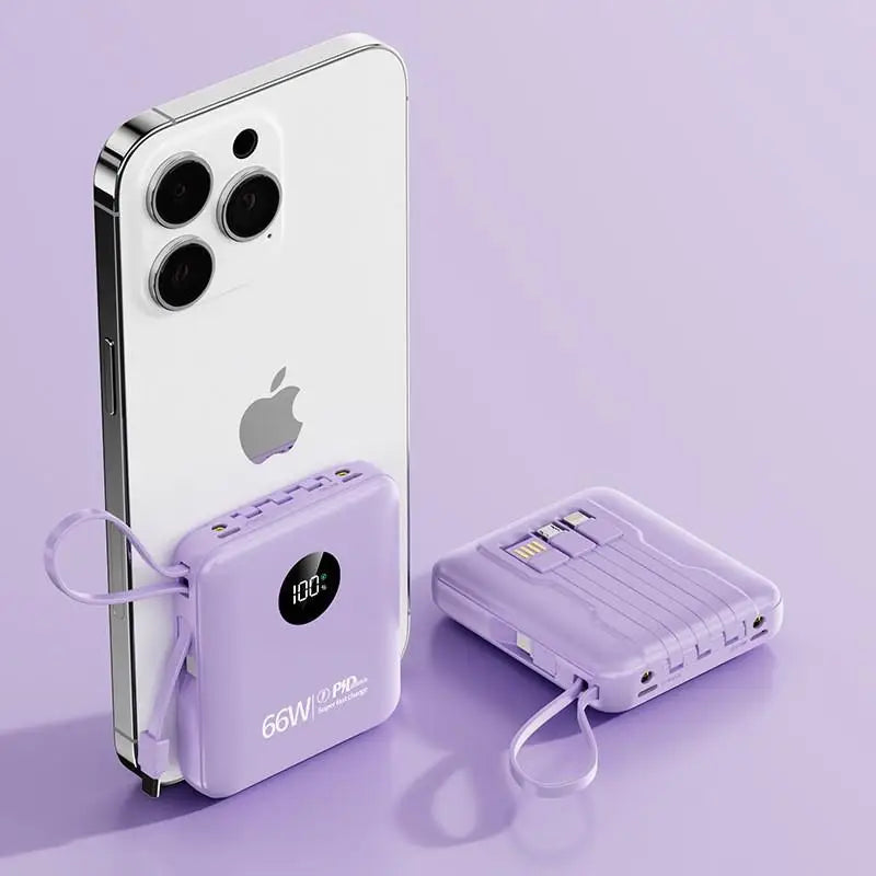 Two compact lilac power banks with digital displays and built-in charging cables shown with a smartphone.