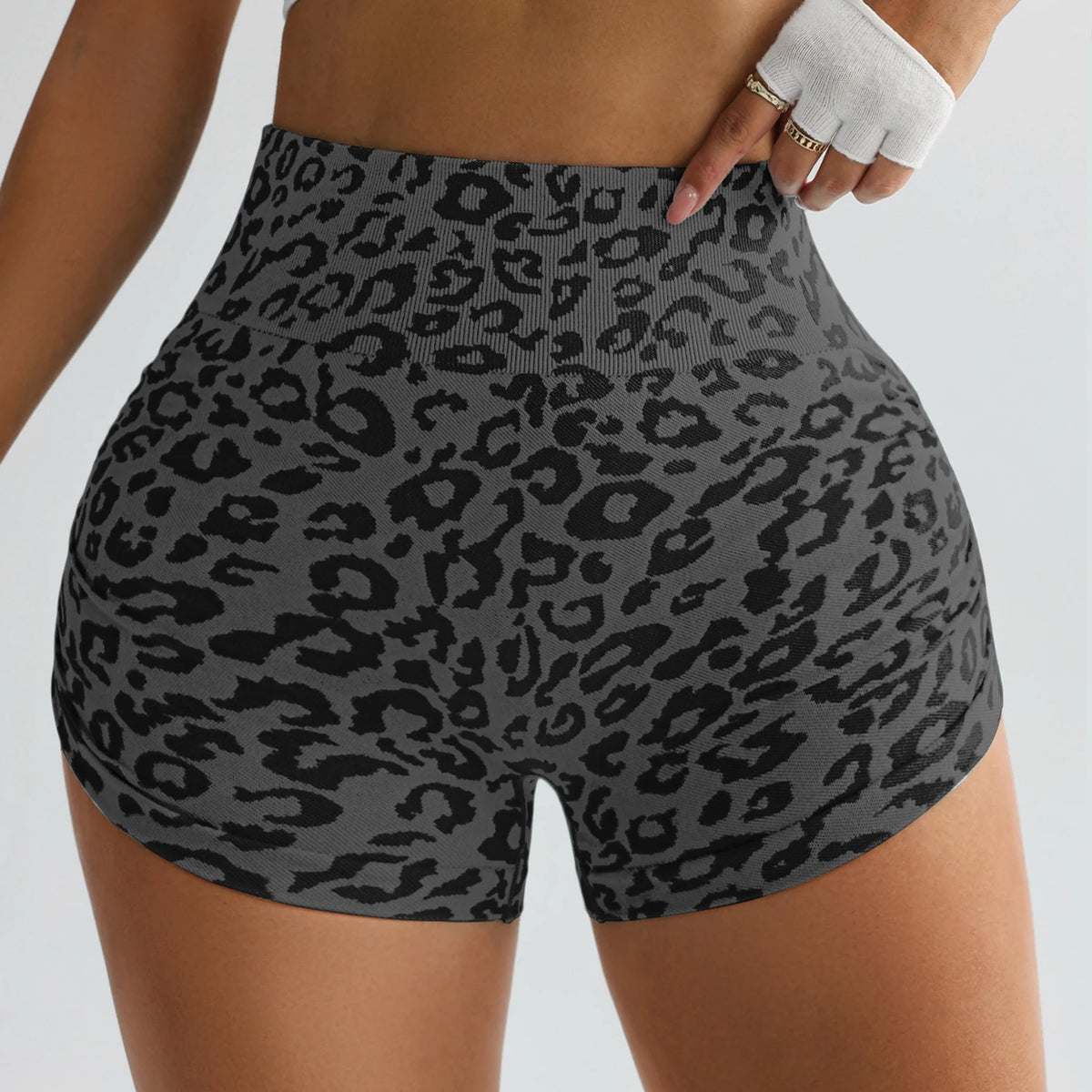 Grey leopard print high-waist workout gym shorts with a tight, form-fitting design.