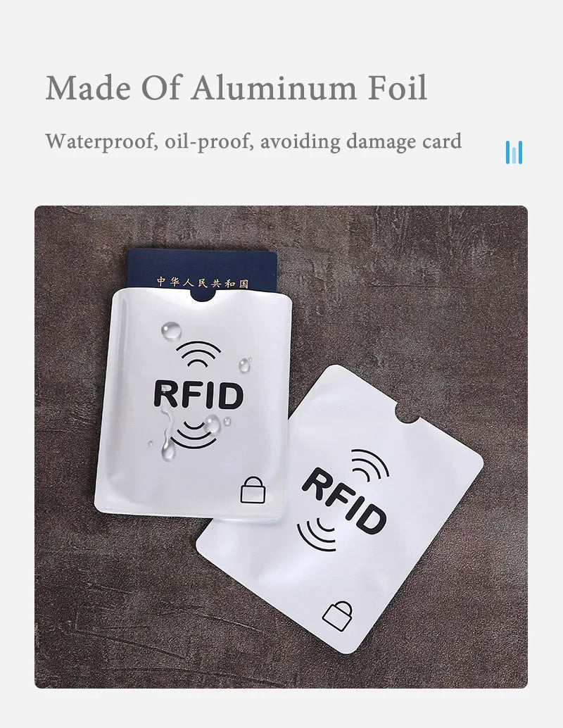 White aluminum foil RFID-blocking card sleeves for credit card and passport protection.