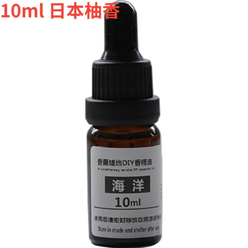 10ml amber glass essential oil bottle with black dropper cap and white label for DIY aromatherapy and candles.