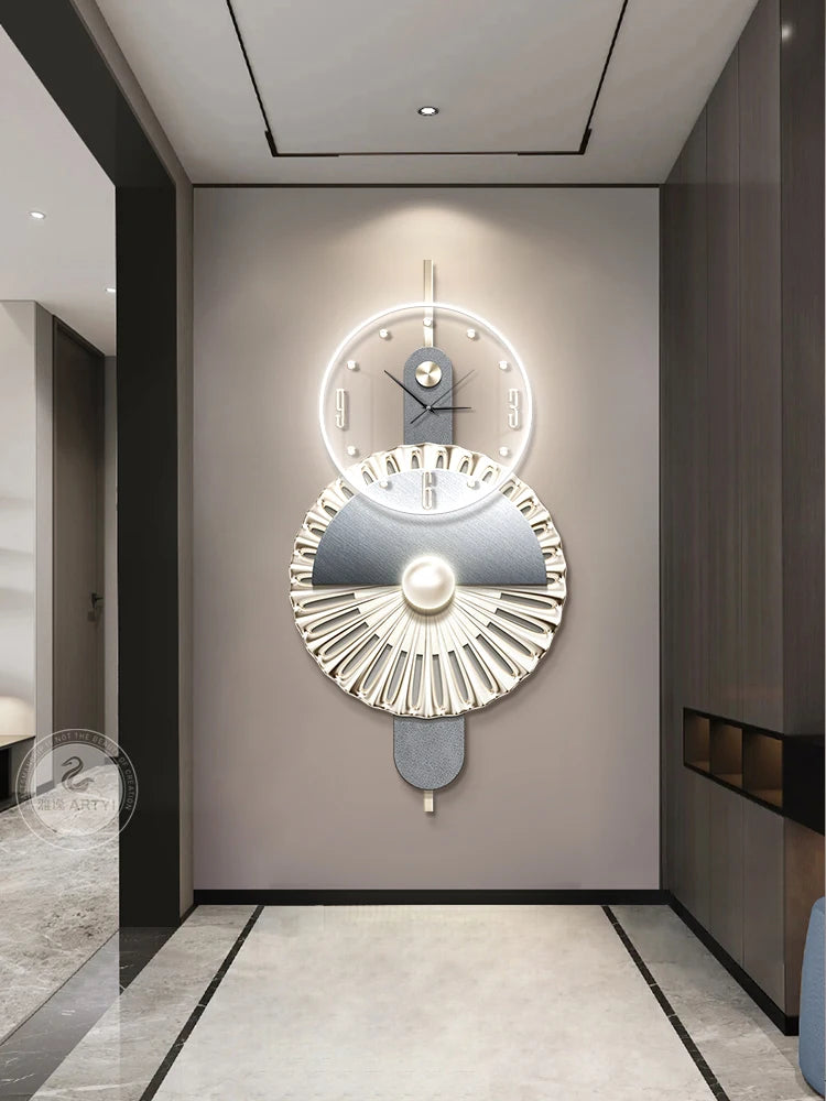 Modern geometric wall clock in grey and gold, featuring a minimalist LED-lit dial and elegant fan-patterned pendulum.