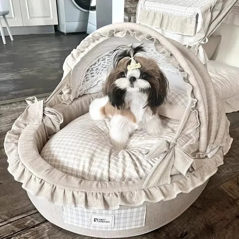 Beige soft dog bed villa with a matching canopy, ruffles, and a plaid cushion holding a small Shih Tzu.
