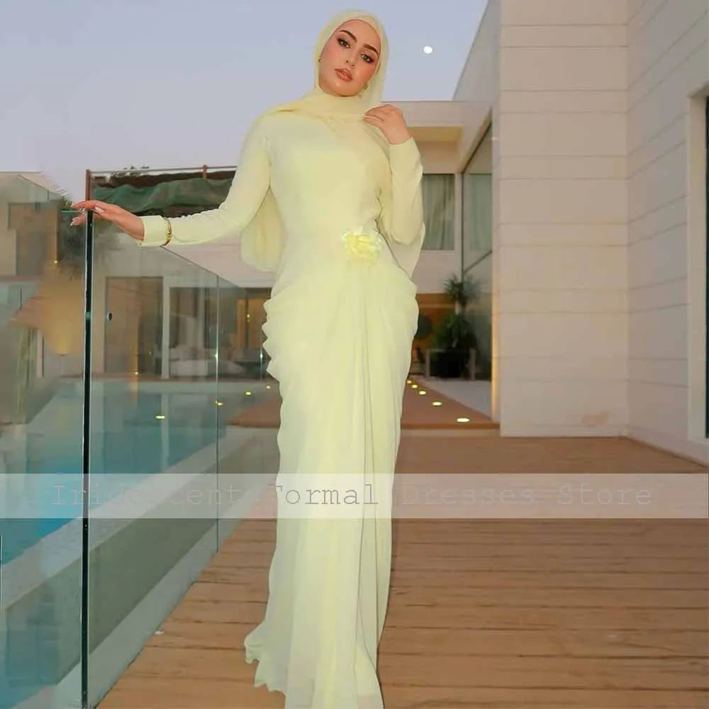 Light yellow long-sleeve high-collar mermaid evening gown featuring a 3D flower and pleated waist.