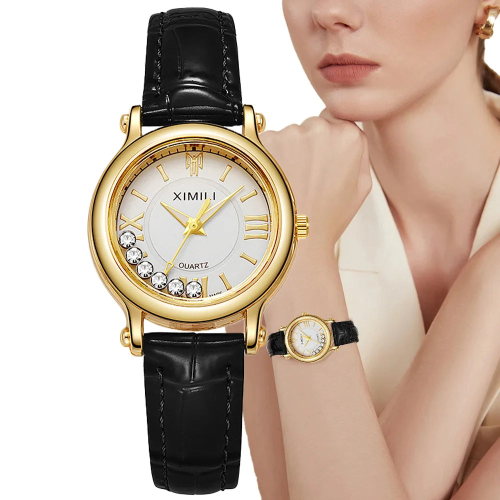 Women's quartz watch with a gold-tone case, white dial featuring crystal accents, and a black textured leather strap.
