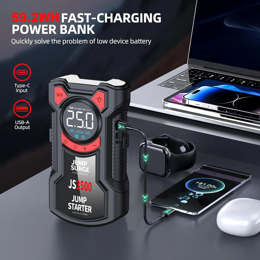 Black portable car jump starter with a digital display and red accents, charging a smartphone via USB.