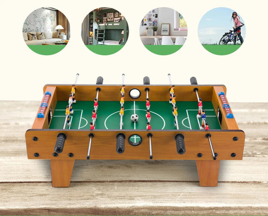 Tabletop foosball game with a classic wood-effect finish, green pitch, sliding scorers, and colourful player figurines.