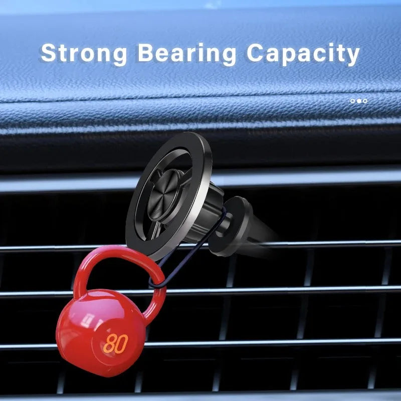 Black car air vent hook holding a miniature red 80-pound kettlebell weight.