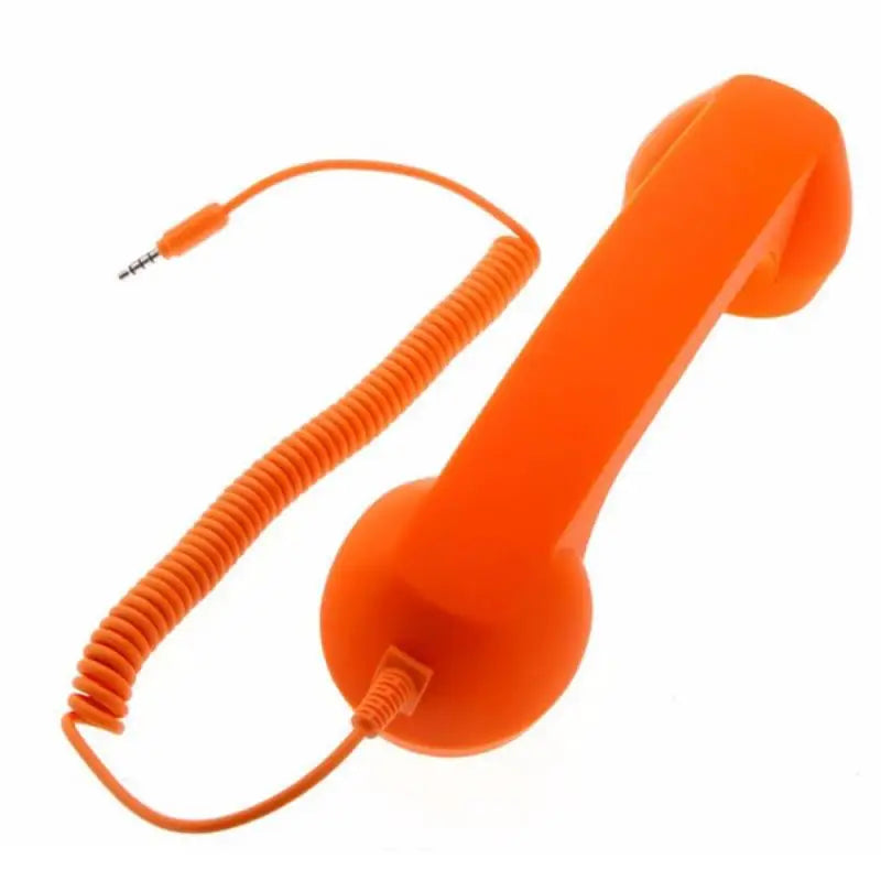 Bright orange retro-style telephone handset with a coiled cable and 3.5mm jack connector, isolated on white.