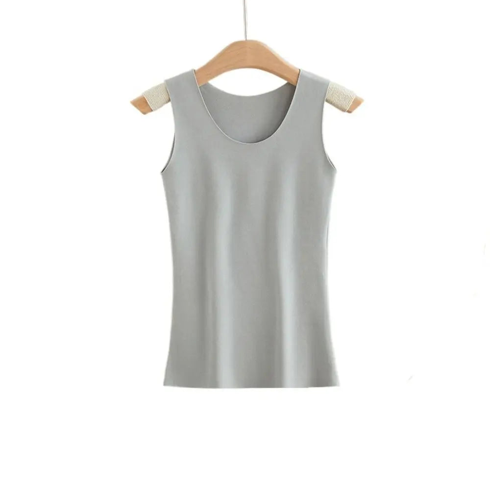Light grey sleeveless vest top with a scoop neckline, hanging on a wooden hanger.