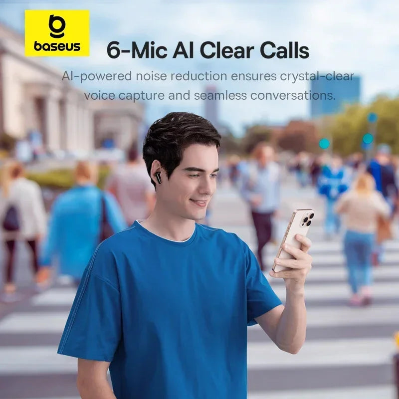 A man in a blue t-shirt walking in a crowd, wearing sleek, black wireless earbuds while looking at his smartphone.