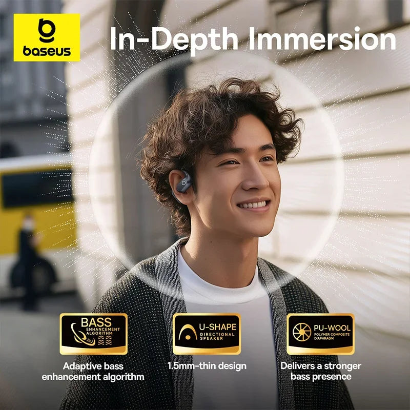 A person wearing sleek, dark grey open-ear wireless earbuds with a slim, U-shaped design for audio immersion.