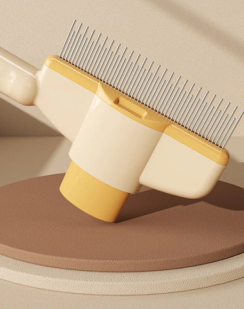 Cream and yellow pet grooming comb with a row of metal teeth, displayed on a textured brown pedestal.