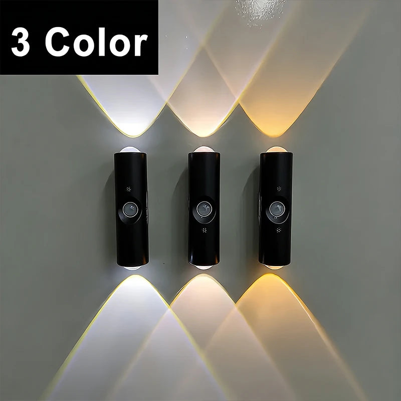 Three black cylindrical motion sensor wall lights showing adjustable warm to cool LED colour light beams.