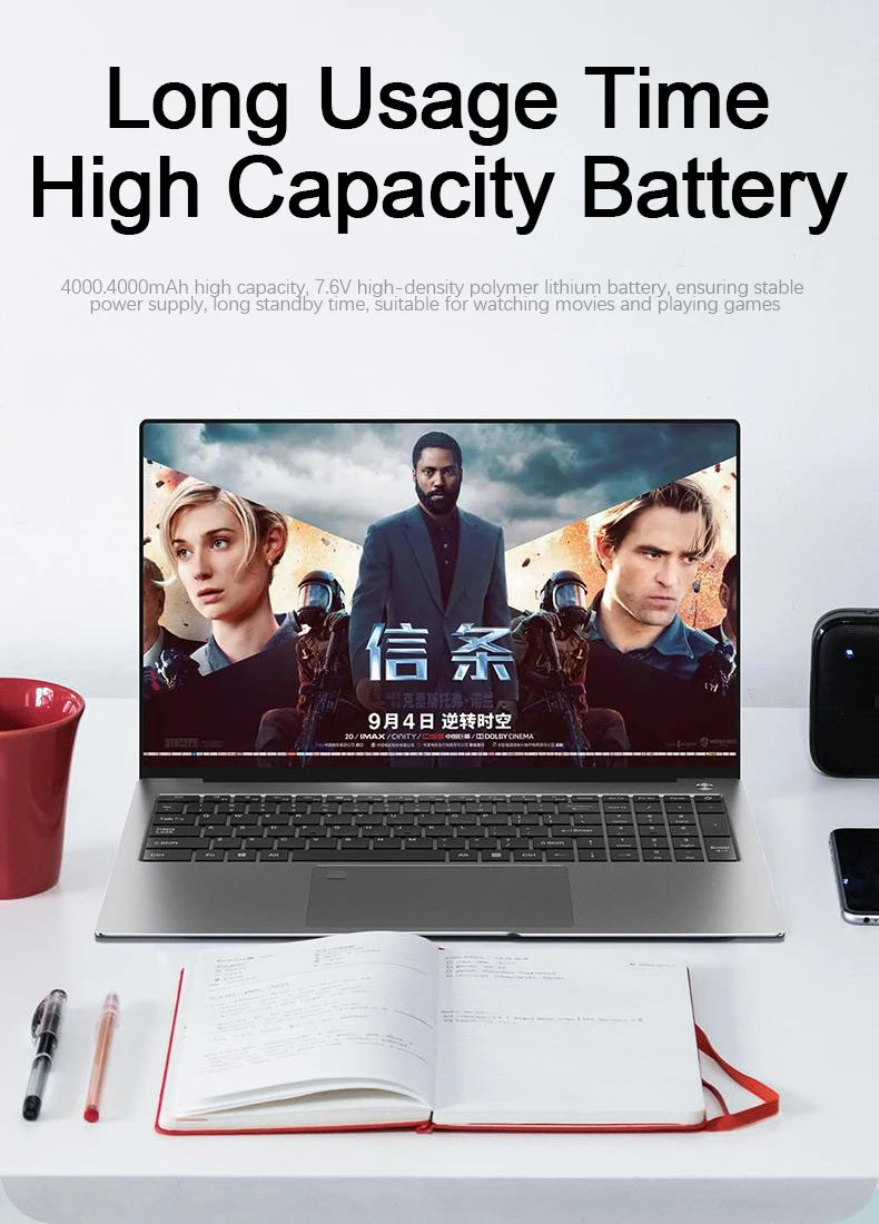 Sleek silver 15.6-inch gaming laptop with a slim-bezel touchscreen displaying a high-definition movie scene.