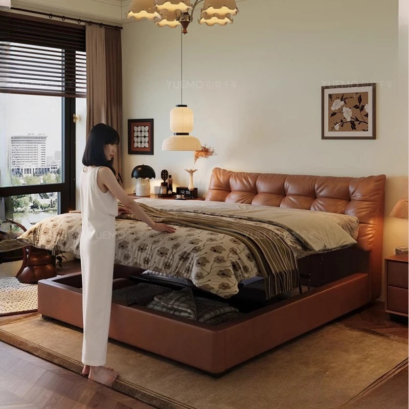 Modern Nordic double bed in tan leather with an upholstered buttoned headboard and convenient under-bed storage.