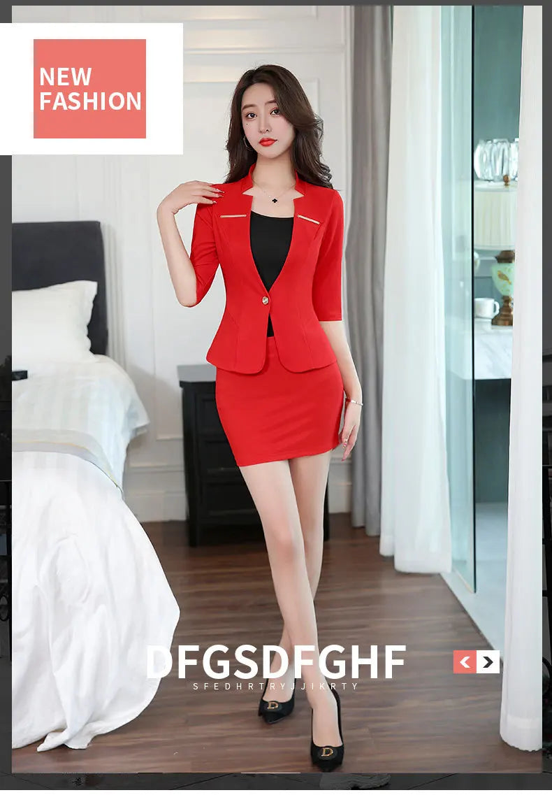 A woman wears a vibrant red suit set featuring a notched-collar blazer with half-sleeves and a matching mini skirt.