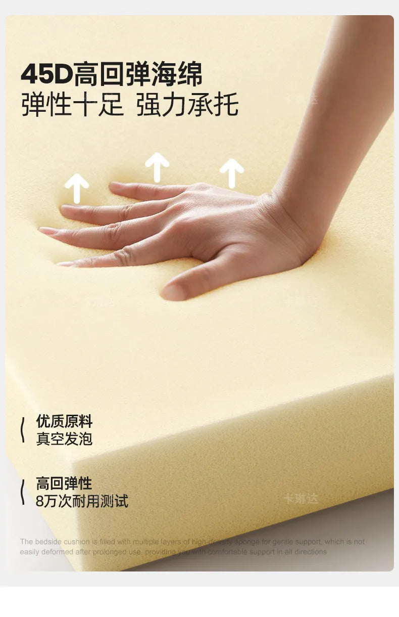 Close-up of a hand pressing into firm, high-density cream-coloured sponge cushion padding for comfortable support.
