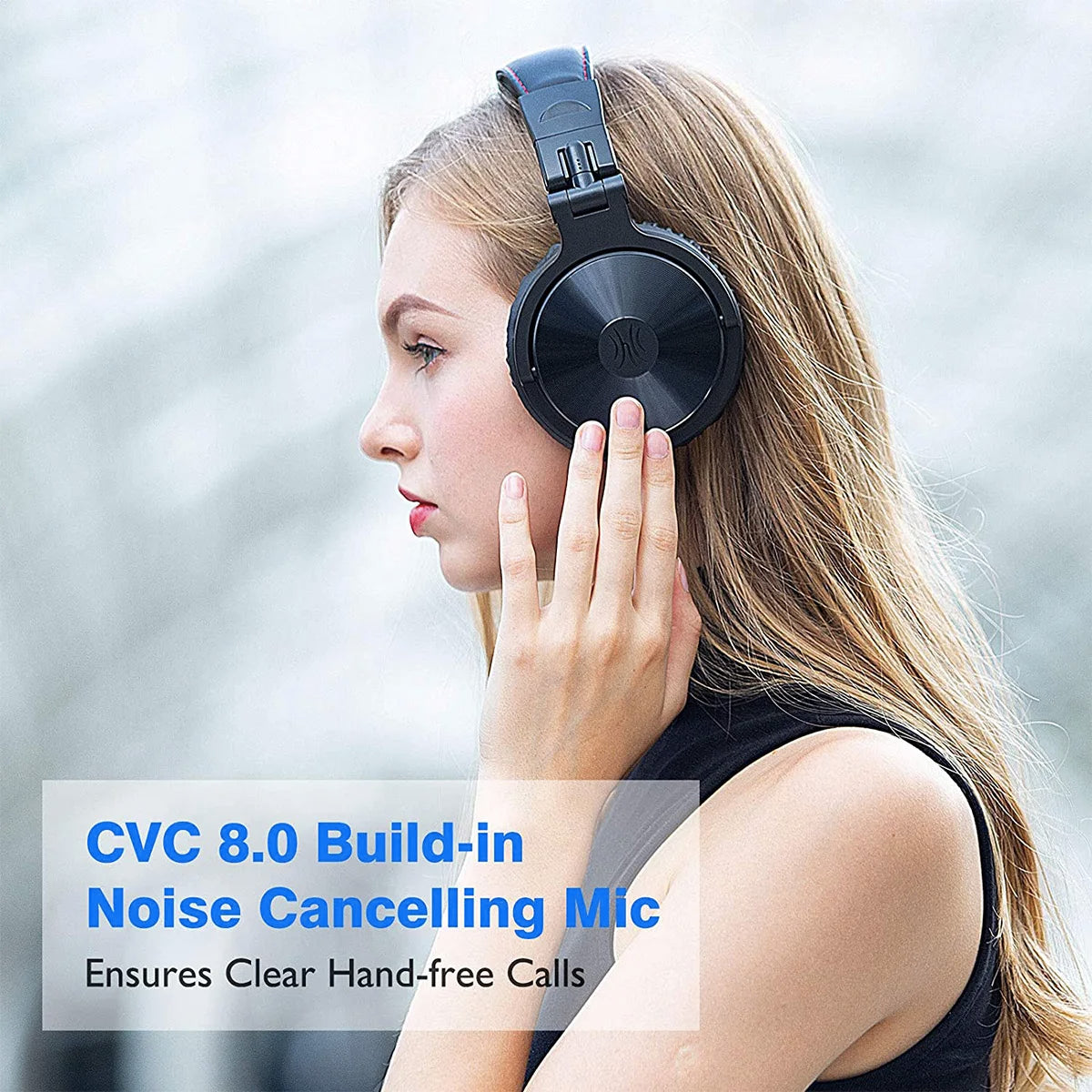 A woman wearing sleek, black over-ear wireless headphones with a built-in microphone for clear, hands-free calls.