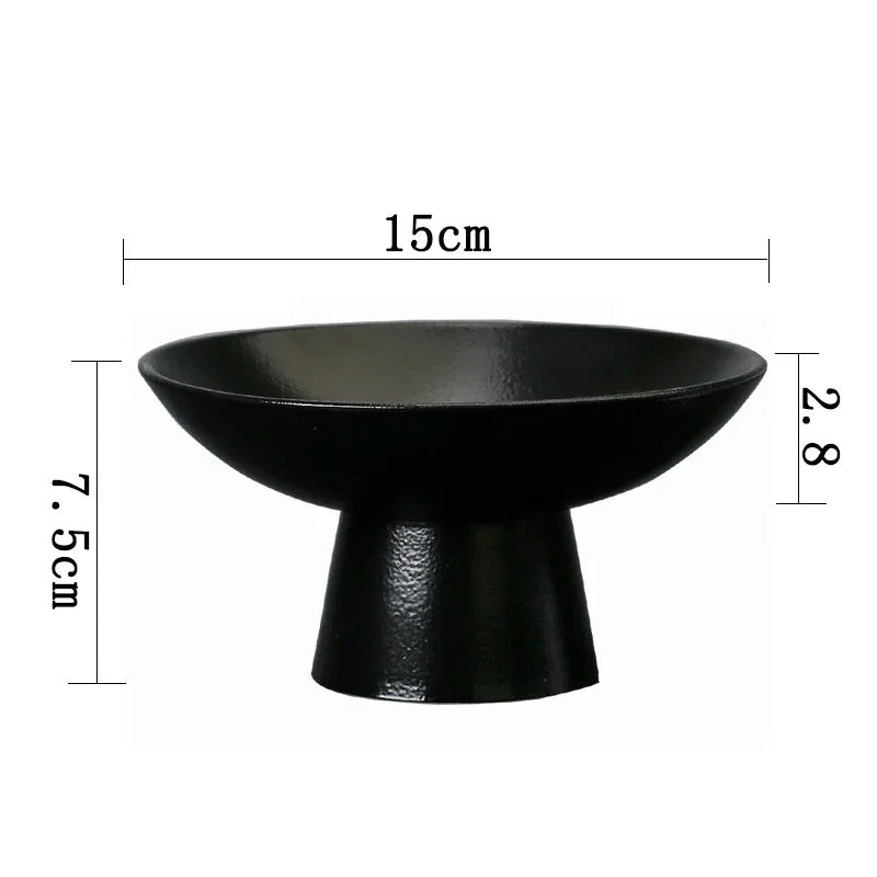 Matte black pedestal bowl with wide rim, 15cm diameter and 7.5cm height. Minimalist, modern decorative dish.
