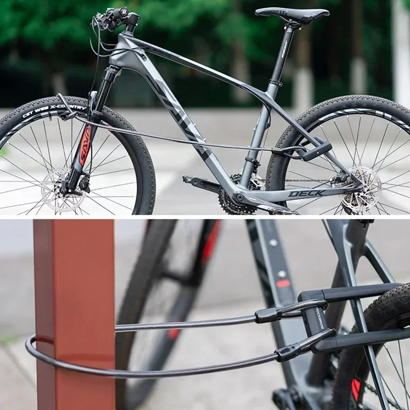 Black ROCKBROS U-lock and cable set securing a mountain bike to a post.
