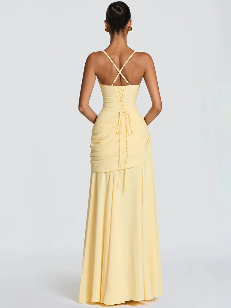 Light yellow sleeveless maxi dress featuring a backless design, lace-up corset back, and draped waist.