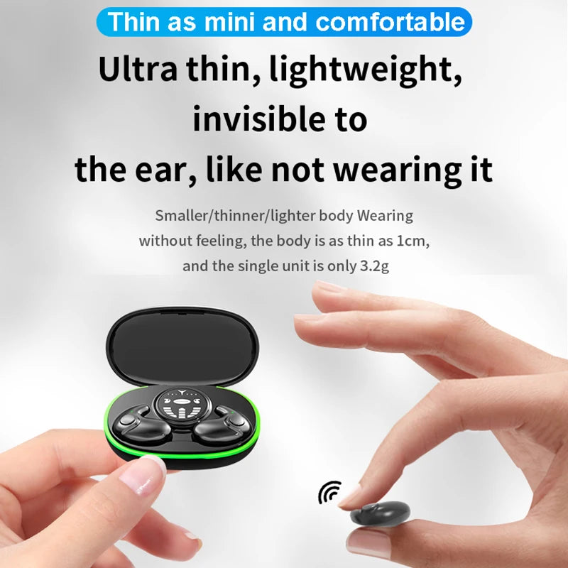 Small black wireless earbuds in a slim charging case with a green accent light, held by fingers.