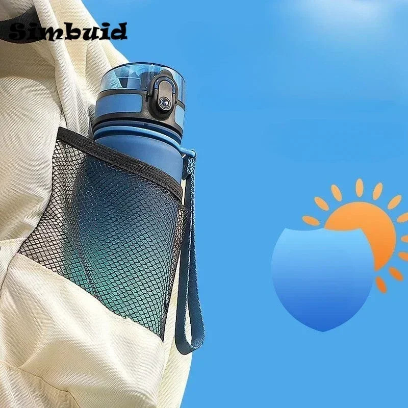 A blue plastic water bottle with a locking lid and carrying strap, tucked into a beige backpack's mesh side pocket.