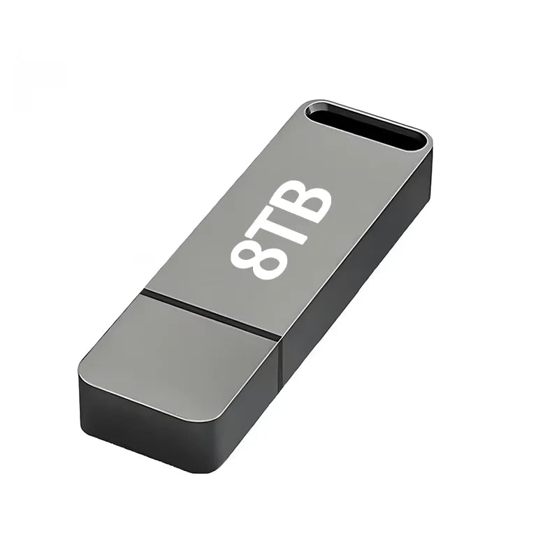 A sleek, dark grey rectangular USB flash drive with an integrated keyring loop and clear storage capacity label.