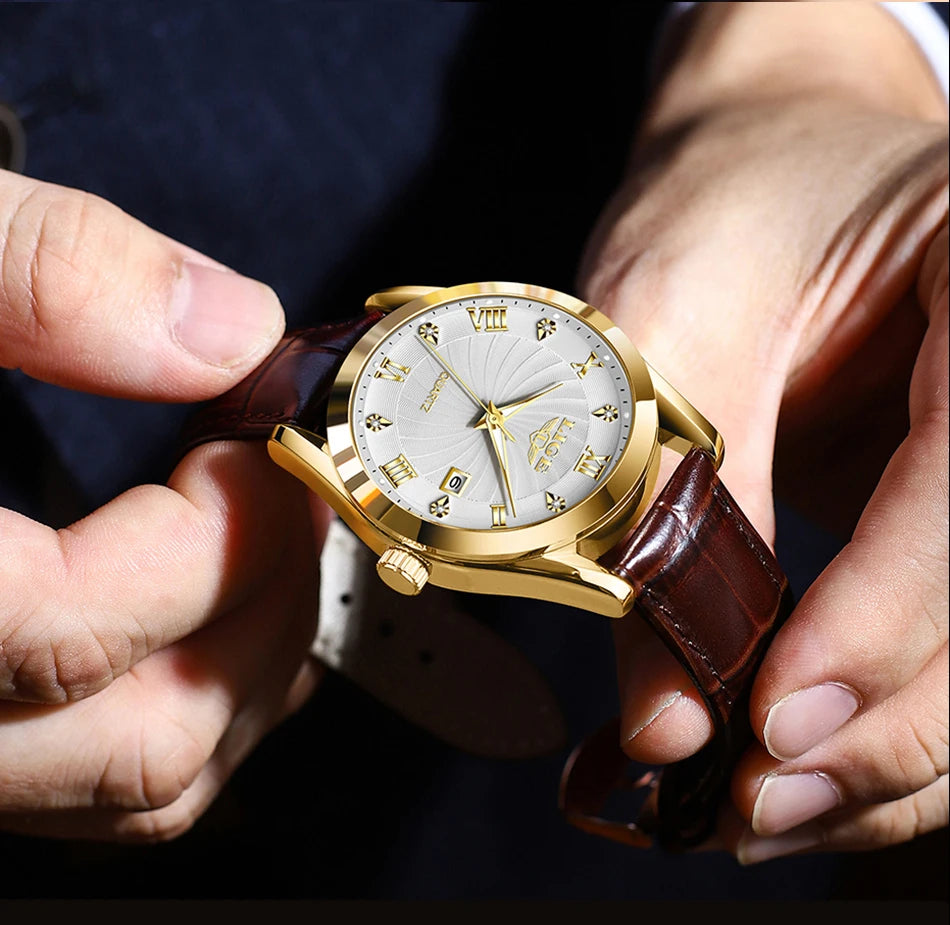 Elegant quartz watch with a gold-tone case, silver patterned dial, Roman numerals and a brown leather strap.