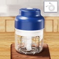 A blue electric mini food chopper with a clear container, metal blades, and an included USB charging cable.
