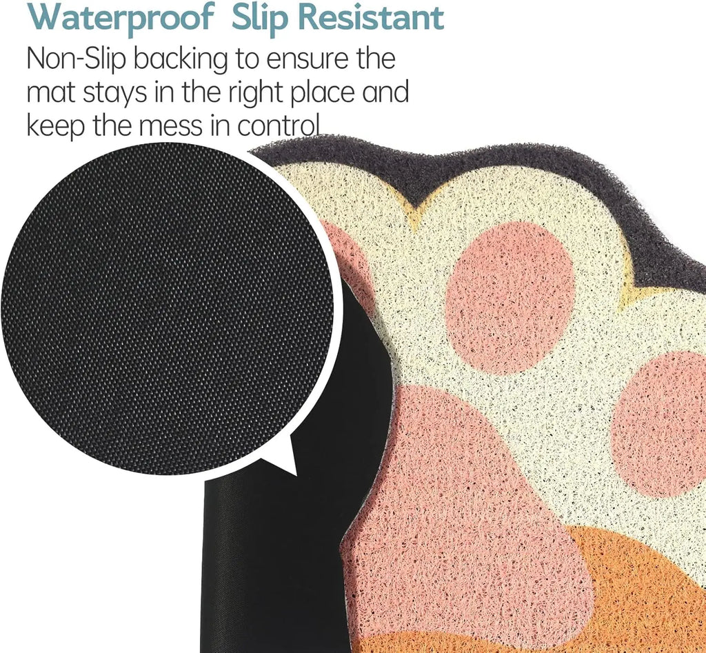 Paw-shaped cat litter mat in cream and pink, featuring a waterproof, textured surface and a black anti-slip backing.