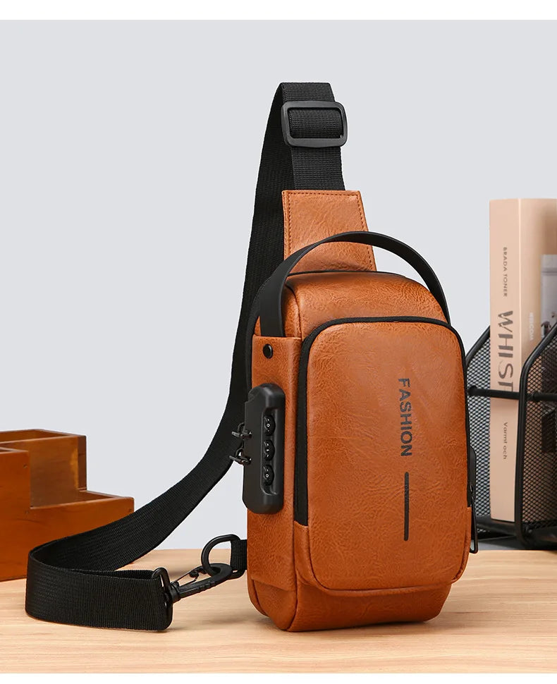 Tan leather crossbody sling bag with a black adjustable strap, integrated combination lock, and side USB port.