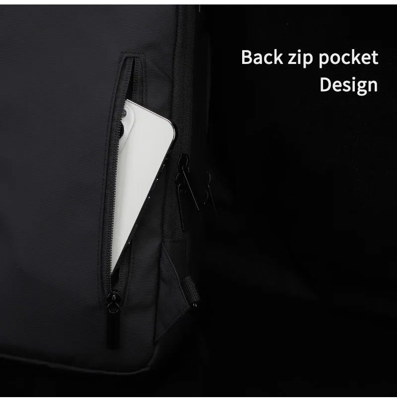Close-up of a black waterproof sling bag featuring a secure vertical zipped pocket on the back, holding a mobile phone.