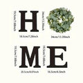 Rustic 'HOME' sign set with black wooden letters and a lush artificial eucalyptus wreath for the letter 'O'.