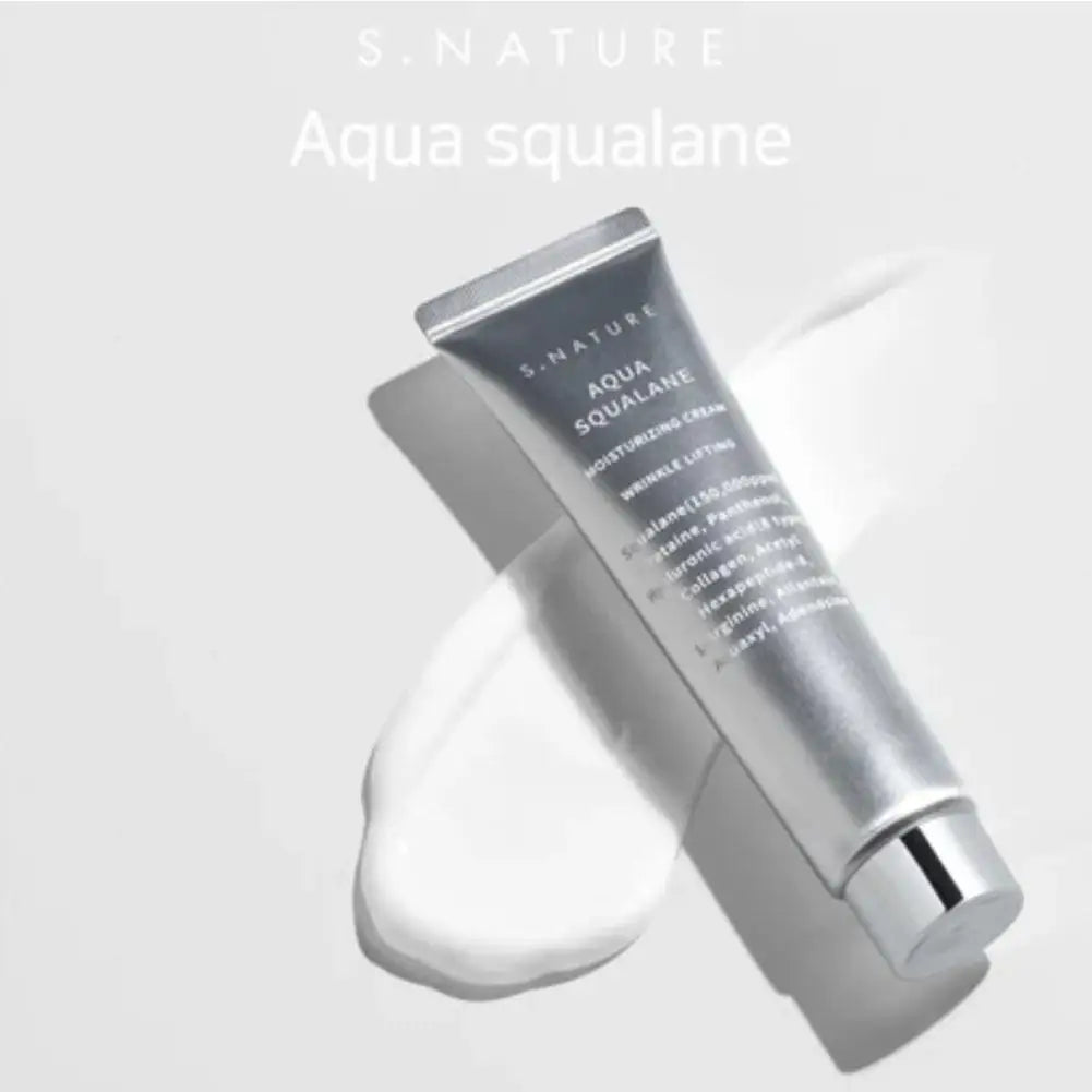 Silver tube of hydrating, anti-wrinkle face cream with a dollop of white cream dispensed on a light background.